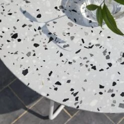 Elio White Round Premium Terrazzo And Metal Garden Table Ref. 4757 11 Elio White Round Premium Terrazzo And Metal Garden Table Ref. 4757 -Tikamoon 1200 1200 elio white round premium terrazzo and metal garden table seats 4 3